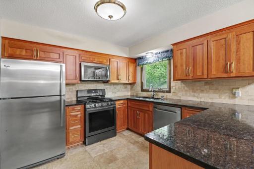 Stainless steel appliances and tile backsplash