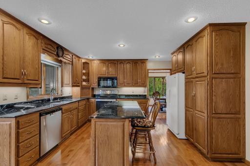 plenty of storage with cabinets that extend to the ceiling