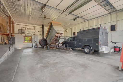 Wood burning stove heats the shop and 82 feet of the massive building