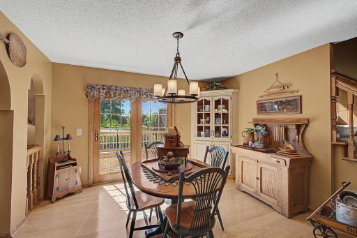 Sliding glass doors that open to the deck over looking the pool and back yard