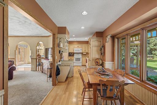 As you enter from the garage this warm and cozy informal dining and kitchen welcome you