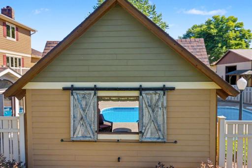 Sliding Barn doors on pool hut open to allow airflow
