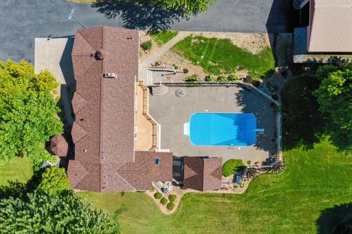 Roof line of home and overview of the pool