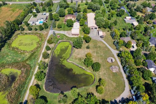 Irrigation pond (a little low this year) and gravel road surrounding the property