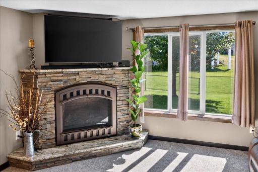 A Stone Fireplace Creates a Cozy Lower-Level Retreat