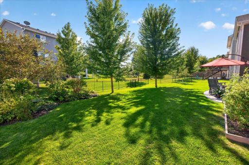 A Fenced Backyard with Room to Relax, Garden, and Play