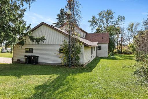 View of attached garage & back of house