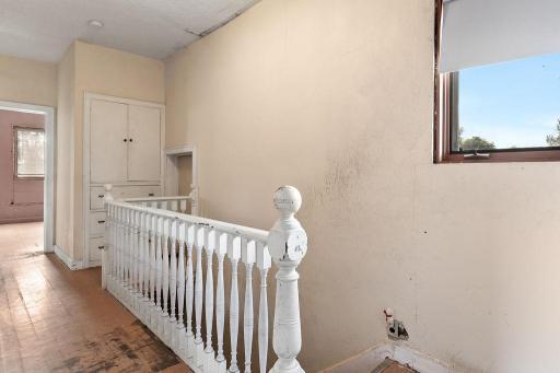 Upper level railing & hall storage