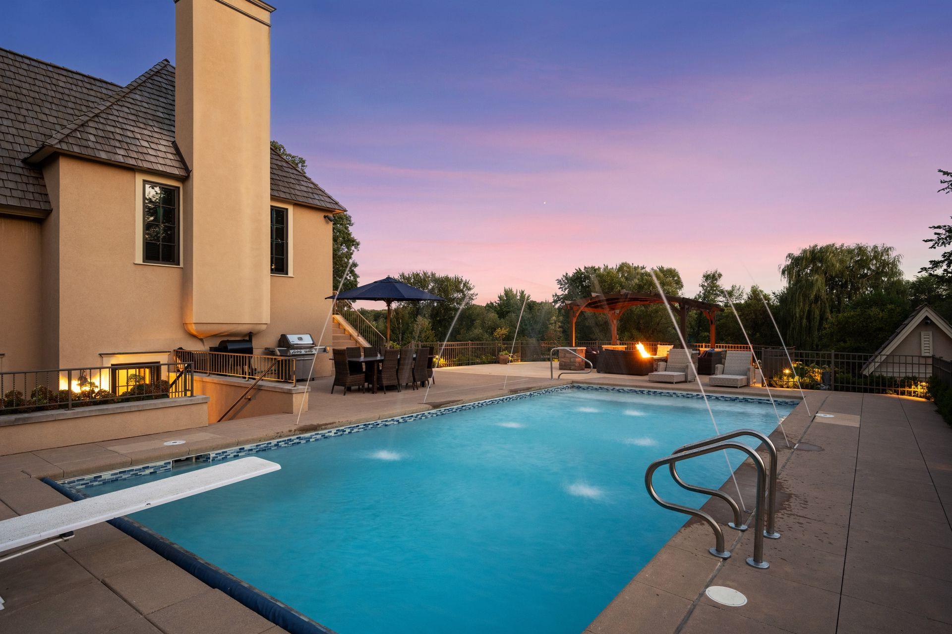 An in-ground pool creates a private resort-like setting overlooking the surrounding grounds.
