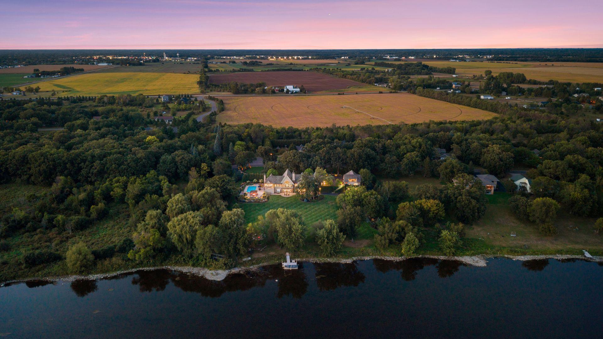Timeless architecture and exceptional craftsmanship define this one-of-a-kind riverfront residence.