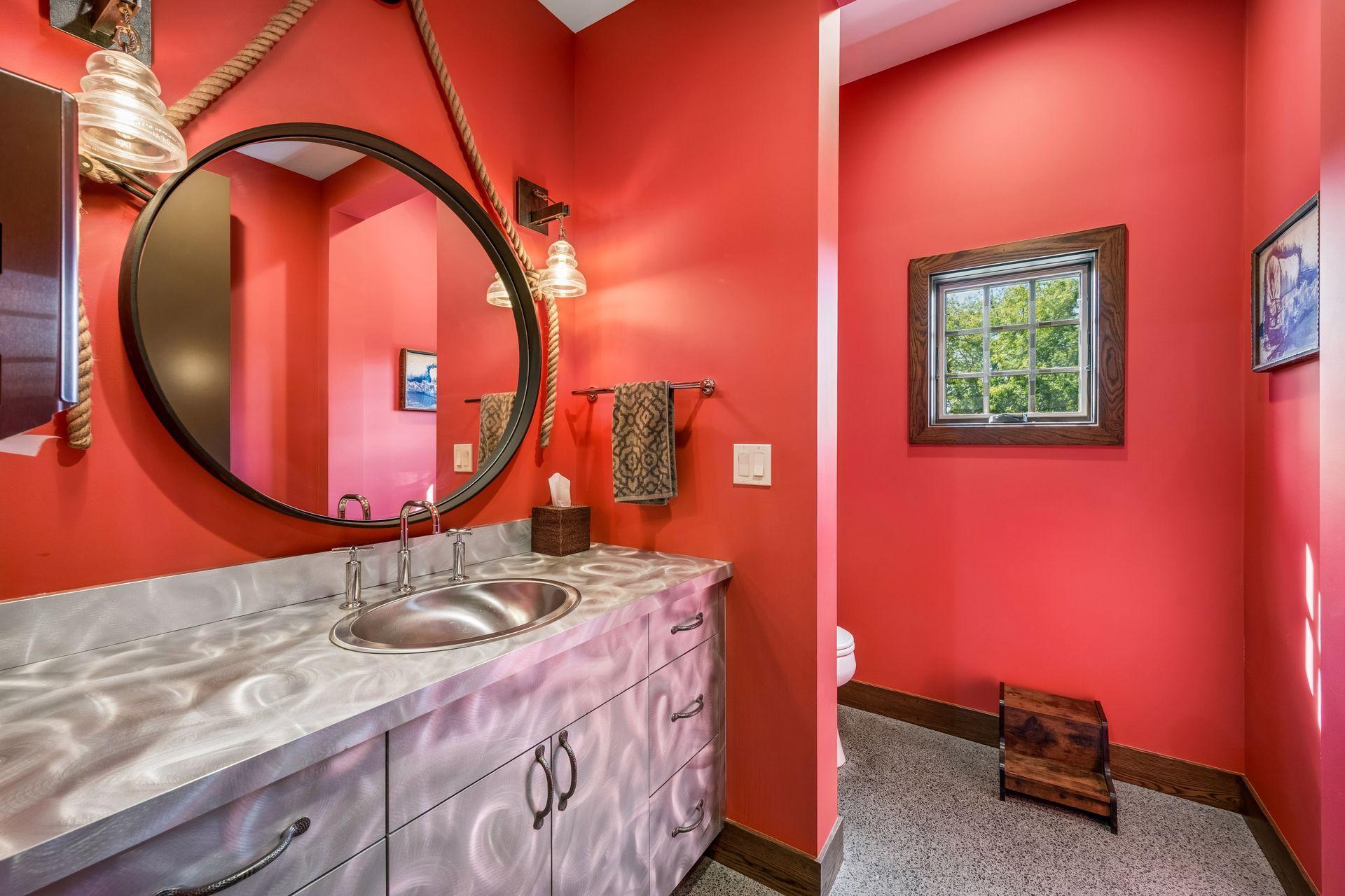 A convenient half bath adds functionality to the detached garage.