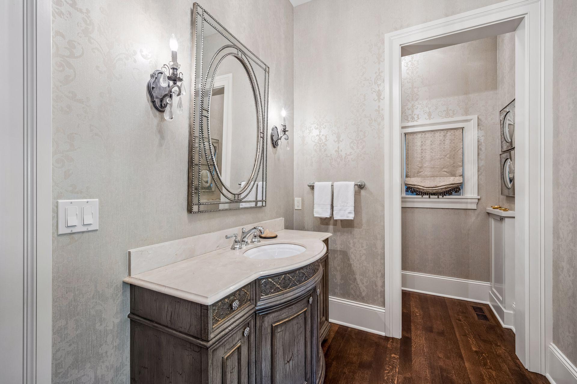 A beautifully designed powder room complements the sophistication found throughout the home.