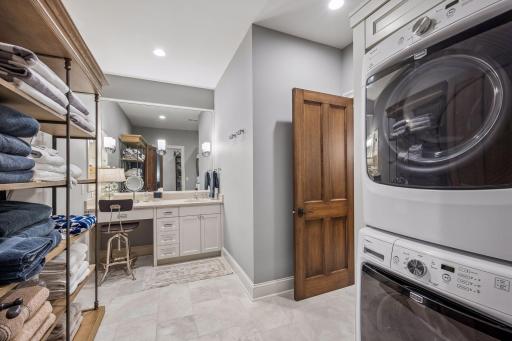 An additional washer and dryer near the pool make summer entertaining exceptionally practical.