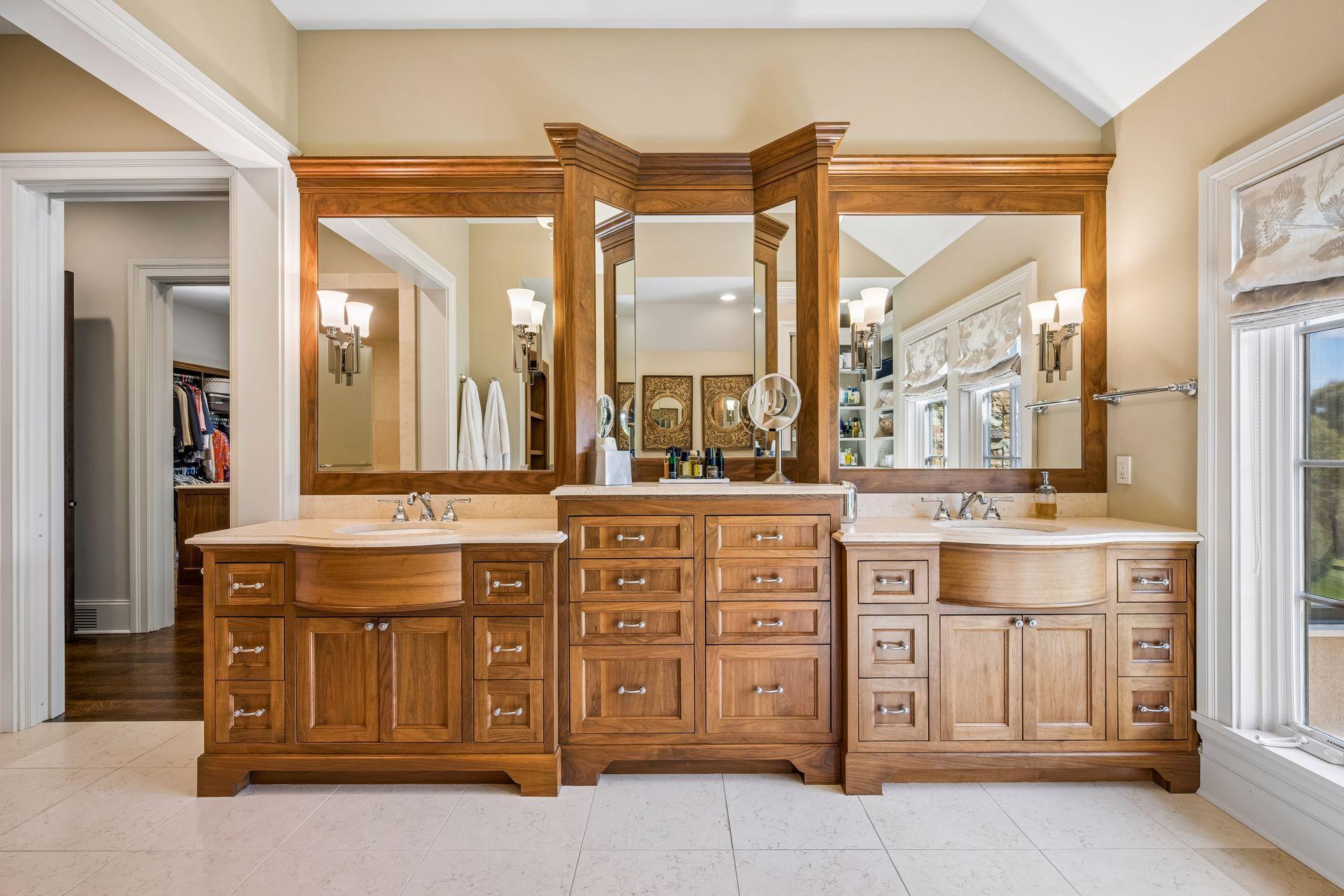 A dual-sink vanity provides generous space and everyday functionality, while in-floor heating adds an additional layer of comfort to the primary bath.