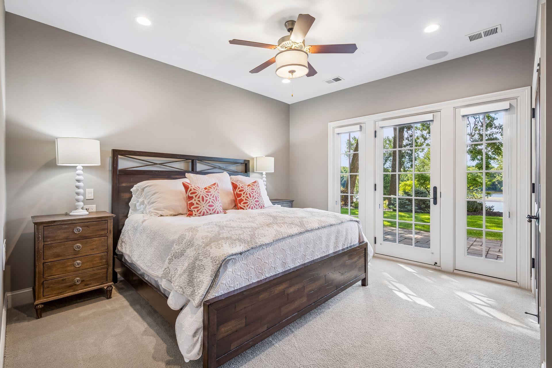 This lower-level bedroom offers direct access to the backyard and patio.