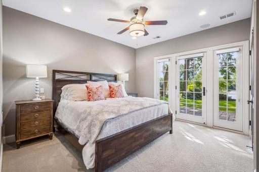 This lower-level bedroom offers direct access to the backyard and patio.
