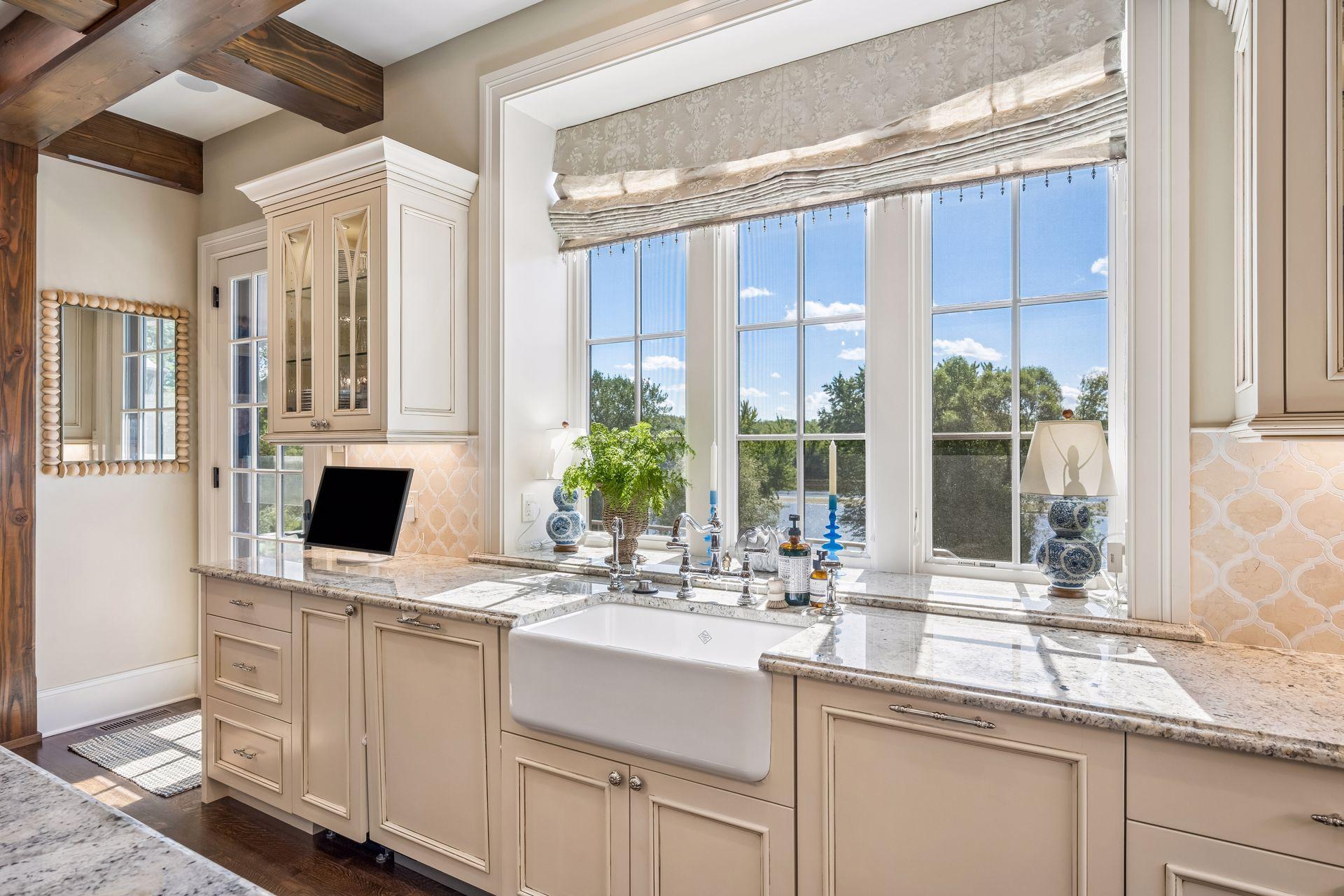 A farmhouse sink adds timeless character to the thoughtfully designed kitchen.