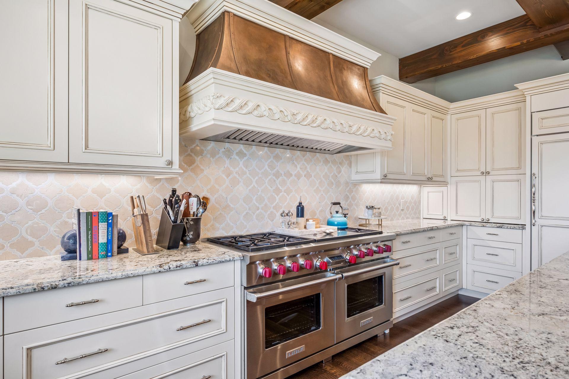 A professional Wolf range and hood elevate the kitchen's culinary capabilities.