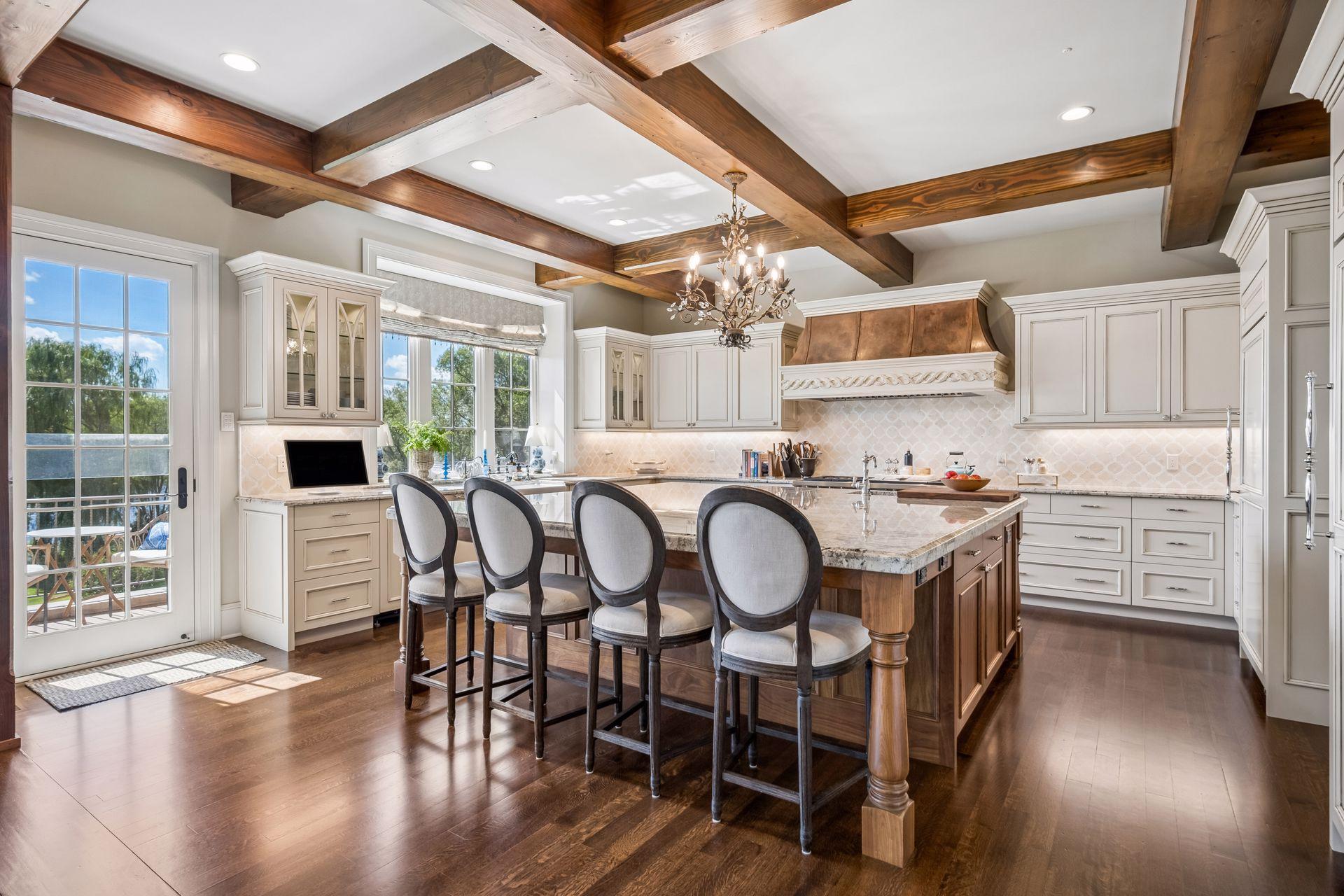 An oversized center island anchors the kitchen and provides generous gathering space.