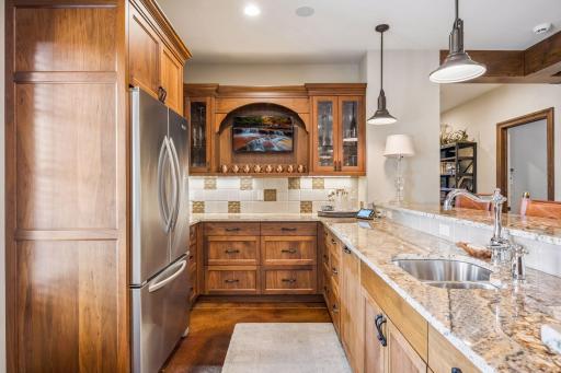 Refrigeration, microwave, and bar seating make hosting effortless.