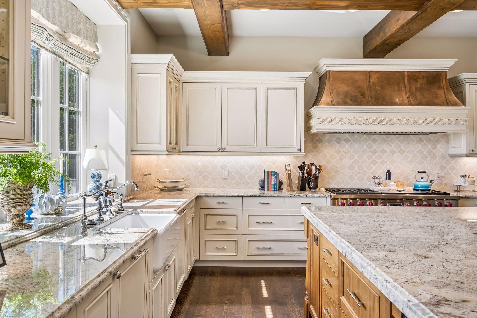 Custom cabinetry creates a refined, cohesive aesthetic throughout the kitchen.