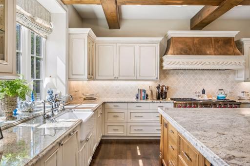 Custom cabinetry creates a refined, cohesive aesthetic throughout the kitchen.