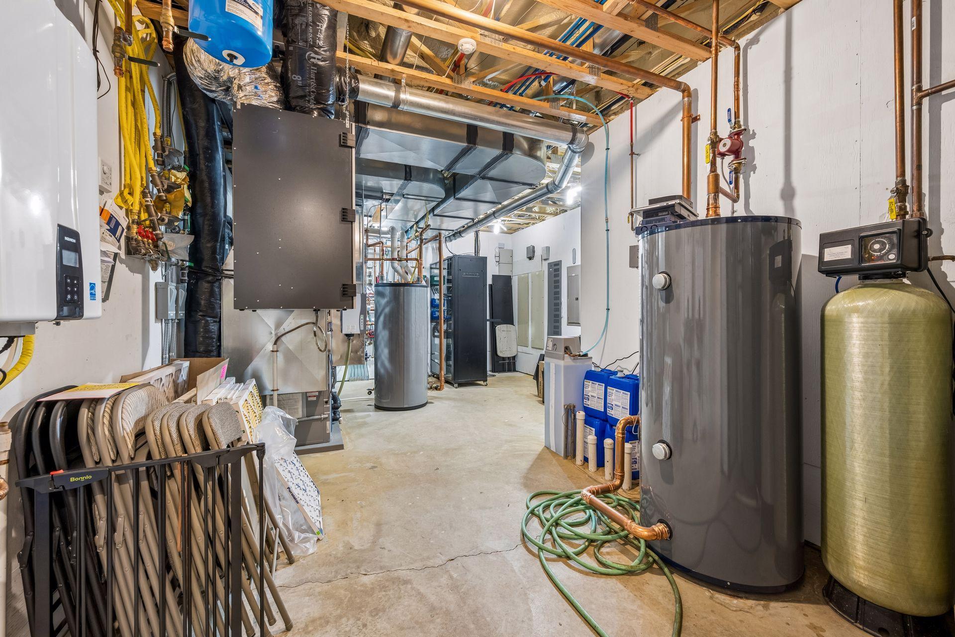 A substantial mechanical command center houses the estate’s sophisticated infrastructure, including geothermal, boiler, HVAC, air exchange, security, surround sound systems, and a Navien water heater.