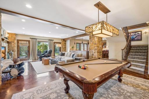 The billiards area offers plenty of room for recreation and gathering.
