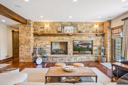 Another fireplace brings warmth and ambiance to the lower-level living space.