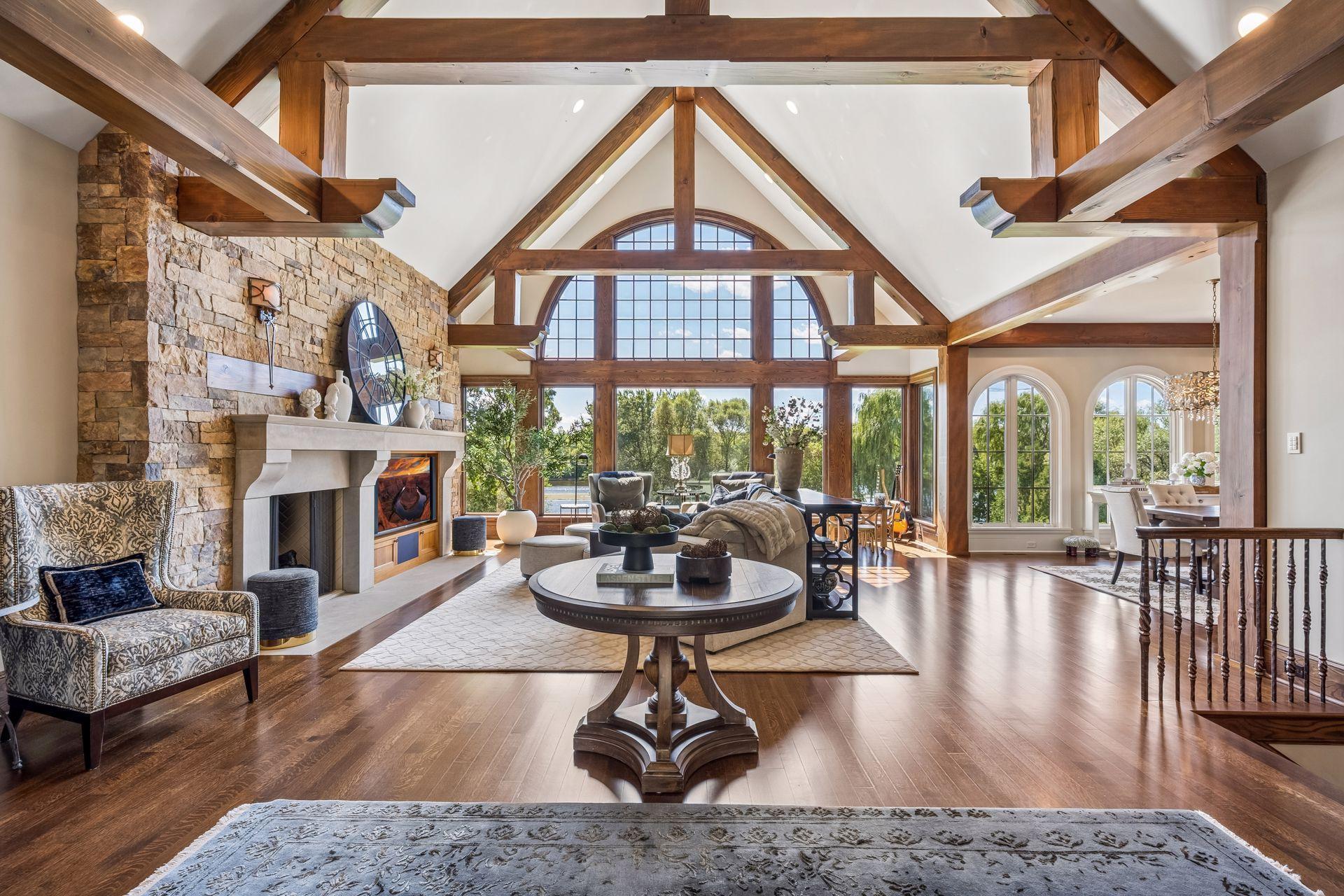 Architectural beams bring warmth and character to the impressive great room.