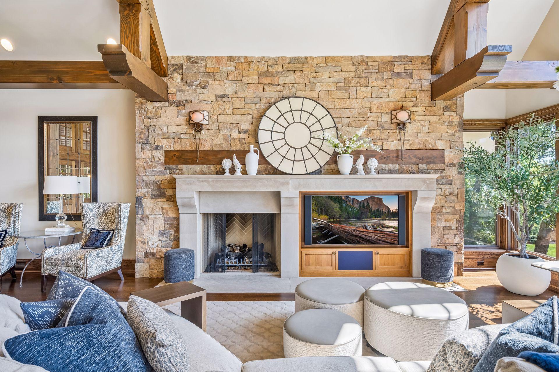 A striking stone fireplace serves as a beautiful focal point in the great room.