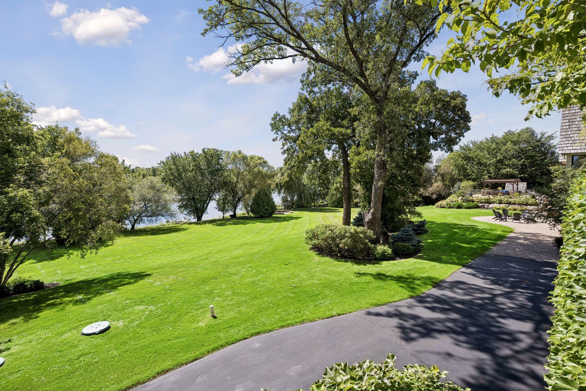 Meticulously maintained landscaping frames the residence and its Mississippi River setting.