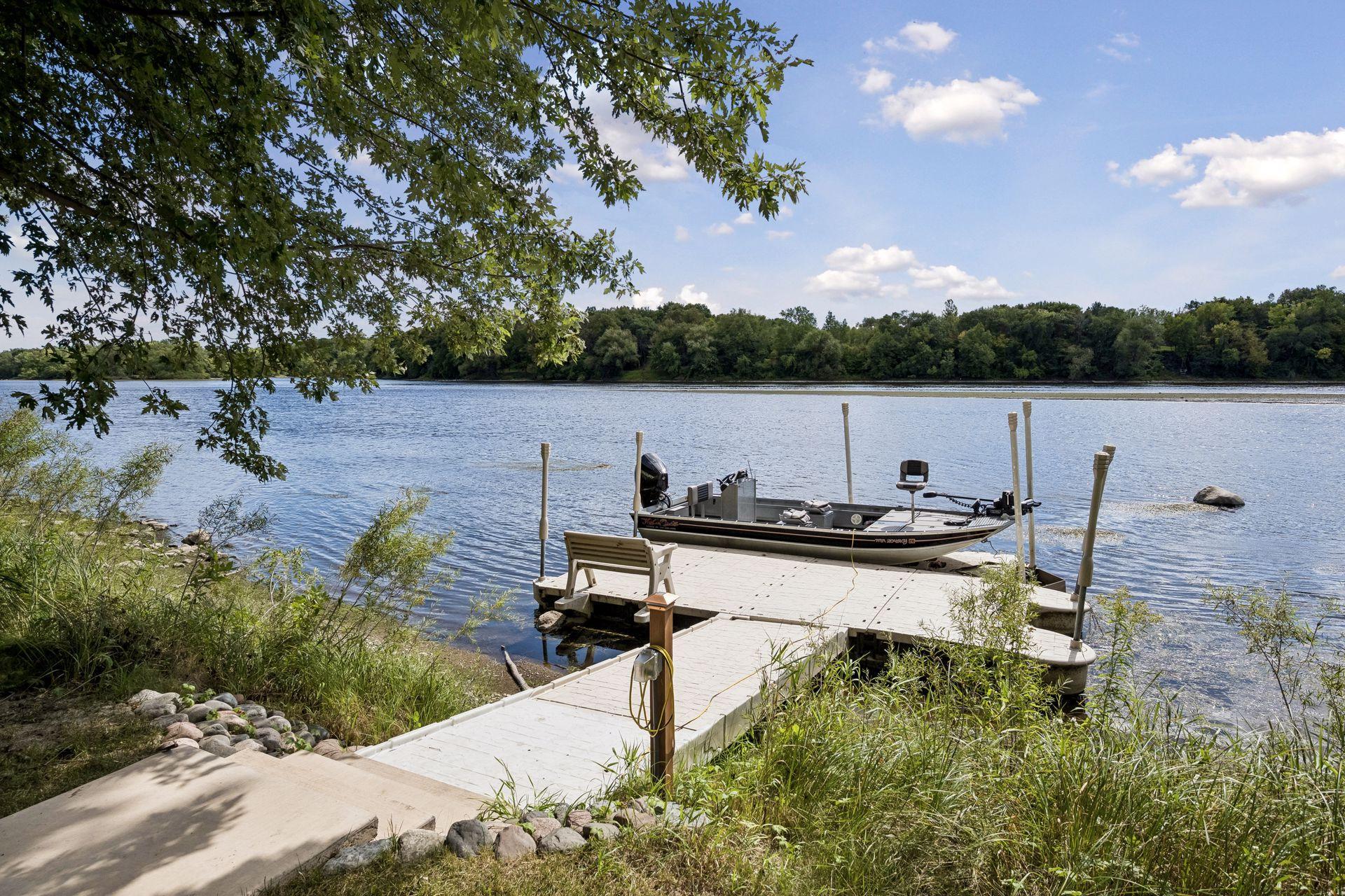 A custom floating dock and powered rail system with a canopied boat trolley provide effortless access to the Mississippi, with full power available at both the dock and rail system.