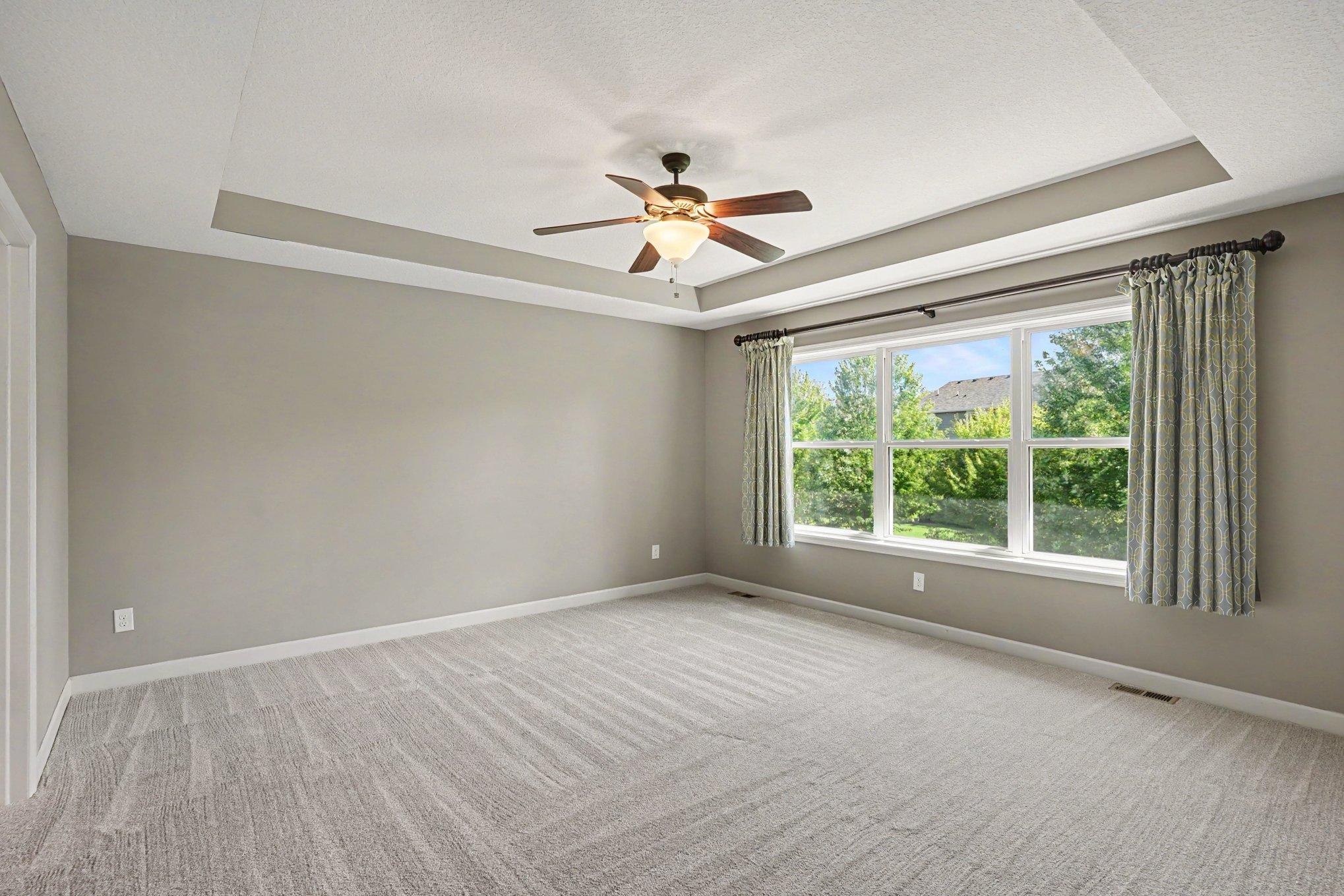 Primary suite overlooking the backyard