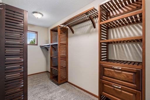 Enormous primary closet with custom shelving.