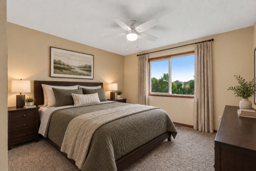 Wake up to peaceful pond views from this spacious bedroom.