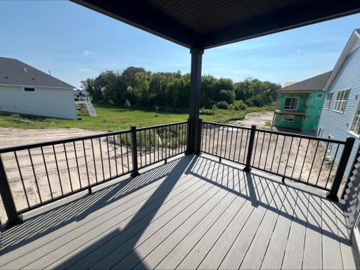 Accessible off the dining room, this covered patio is where residents can bask in views of the neighborhood and enjoy leisurely activities in the open air.