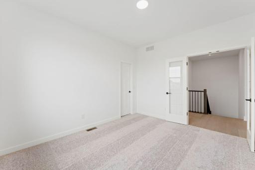 This flex space can be used as a home office, recreation space, or even a guest suite.