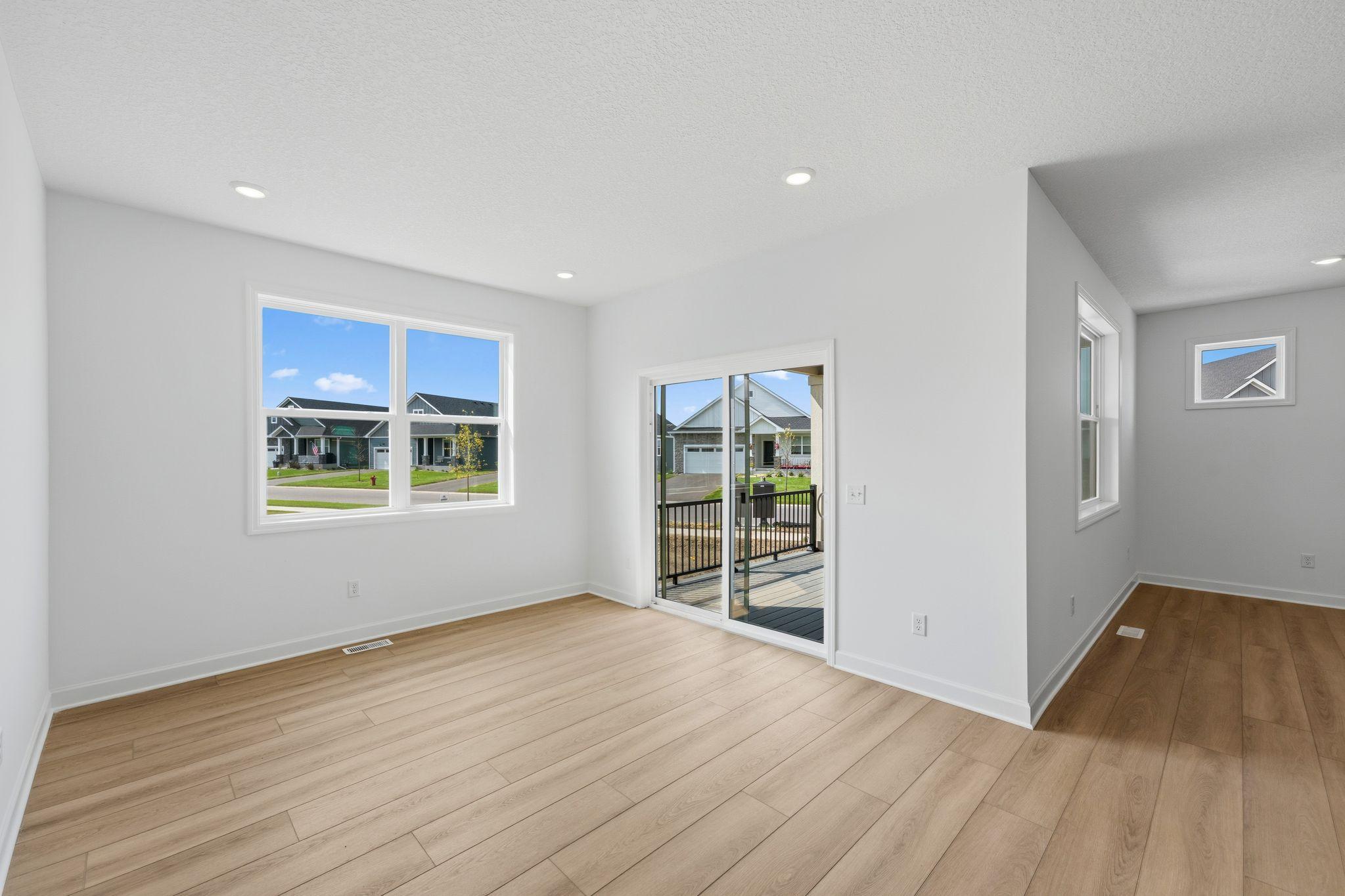 The dining room features sliding-glass doors to the covered patio, an ideal set-up for indoor-outdoor entertaining.