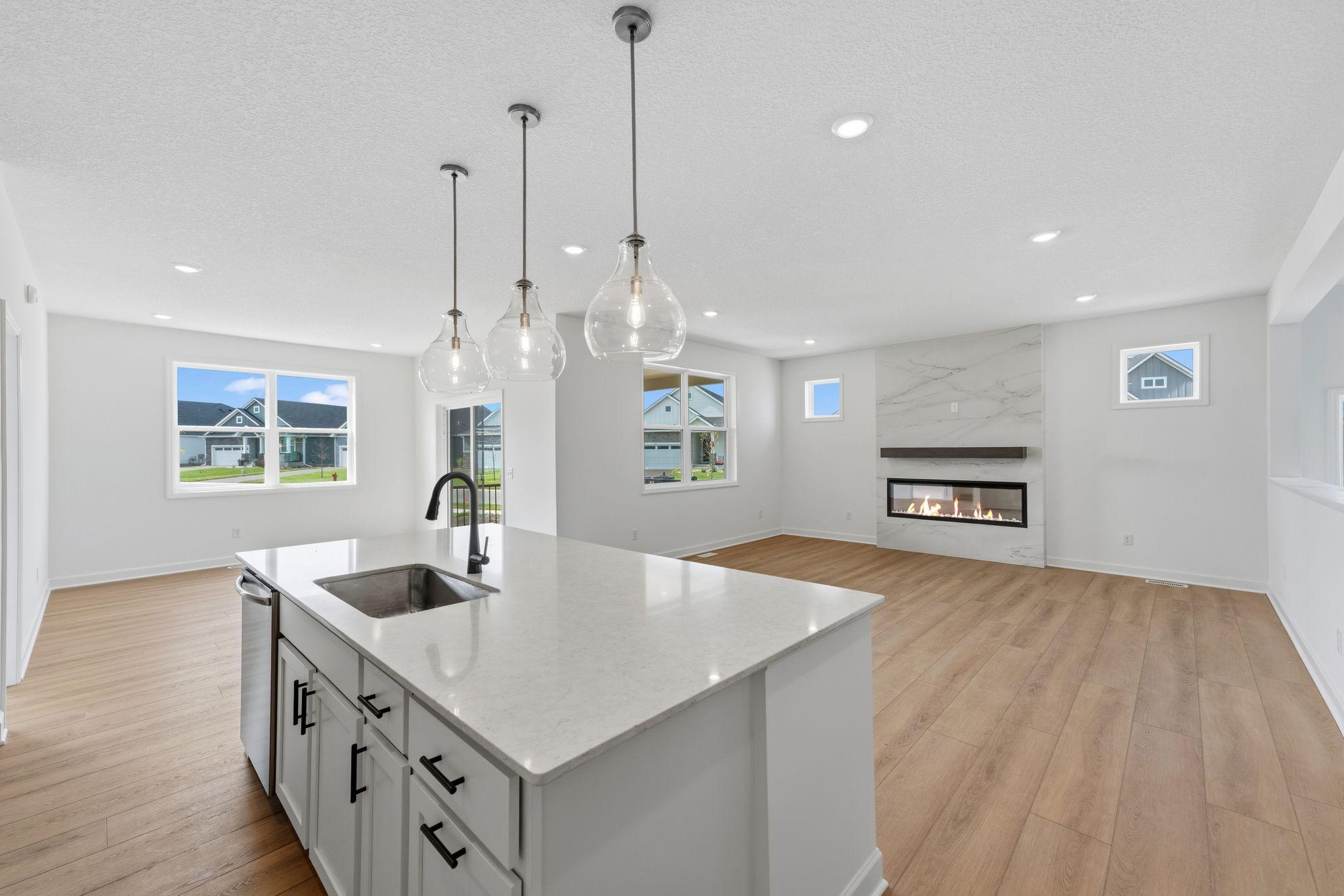 An open-design kitchen flows seamlessly into the dining room, simplifying mealtimes