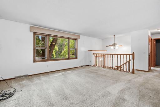 Spacious and bright, the main living area provides plenty of flexibility for arranging your favorite furniture and gathering spaces.