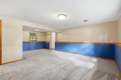 A large family room offers additional space for games, hobbies, a playroom or additional entertainment space.