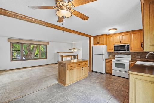The kitchen sits at the heart of the main level with convenient sightlines into the adjoining living space.