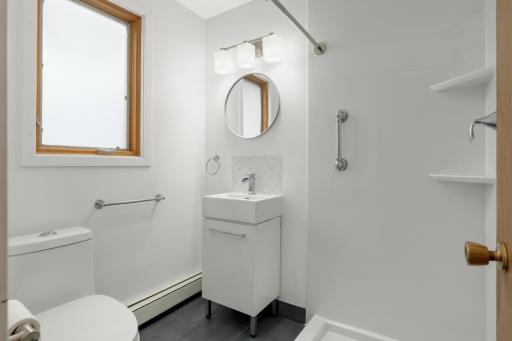 Completed renovated 3/4 bathroom on the lower level next to the rear entry of home