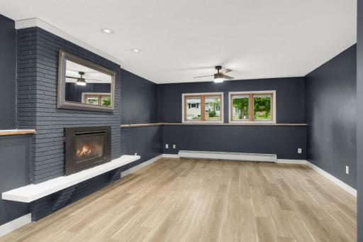 Gas fireplace with brick surround & ceiling fan