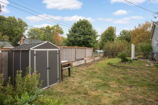 Storage shed. Raised pollinator and vegetable gardens.