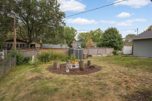 The backyard is fenced on three sides. The back fence is a bamboo screened privacy fence.