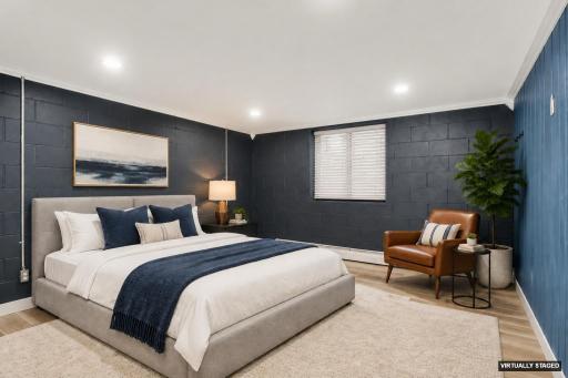 Finished basement flex room with recessed lights and egress window (virtually staged as 5th bedroom)