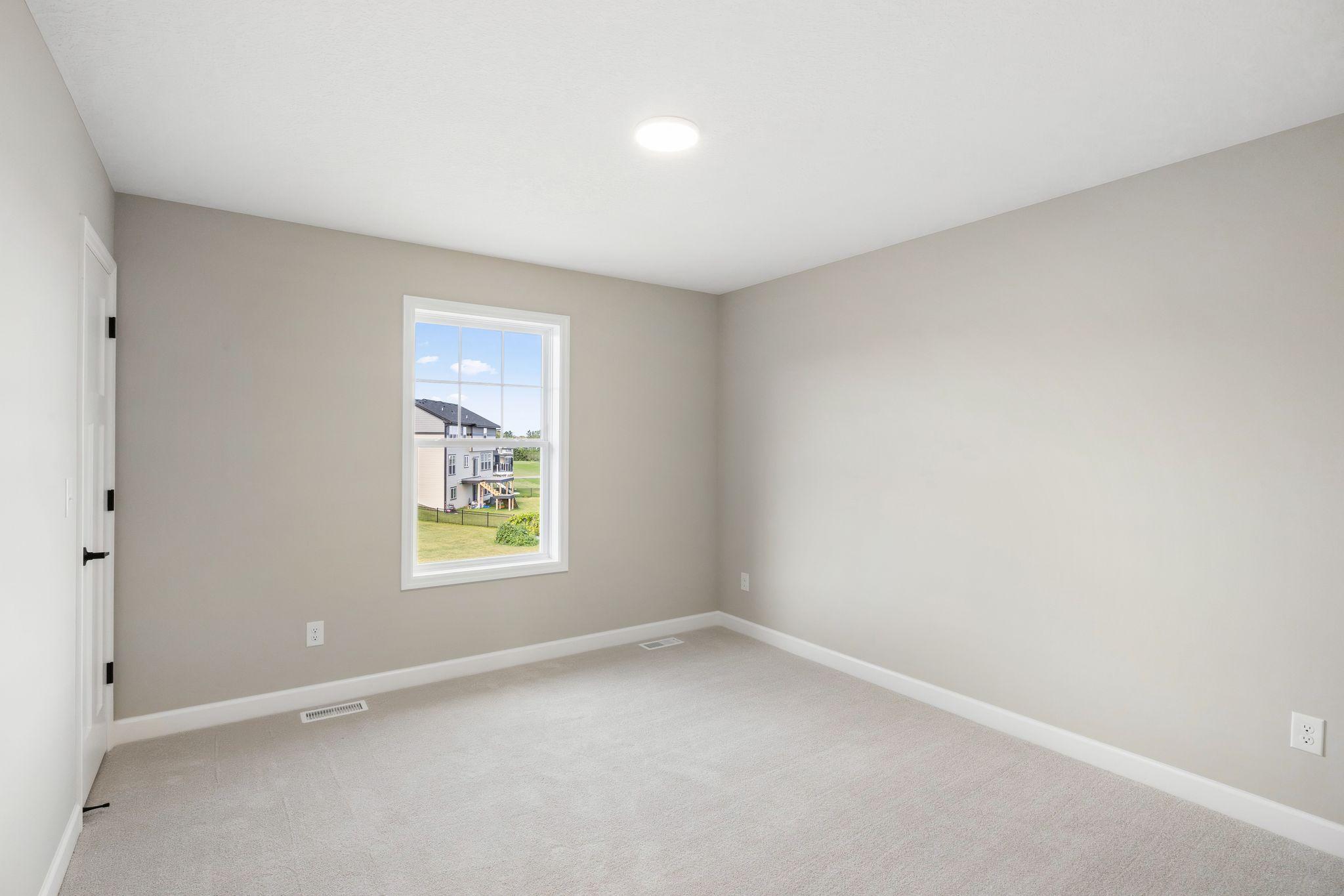 The fourth bedroom is situated on the other end of the home, making it the perfect option for a guest room.