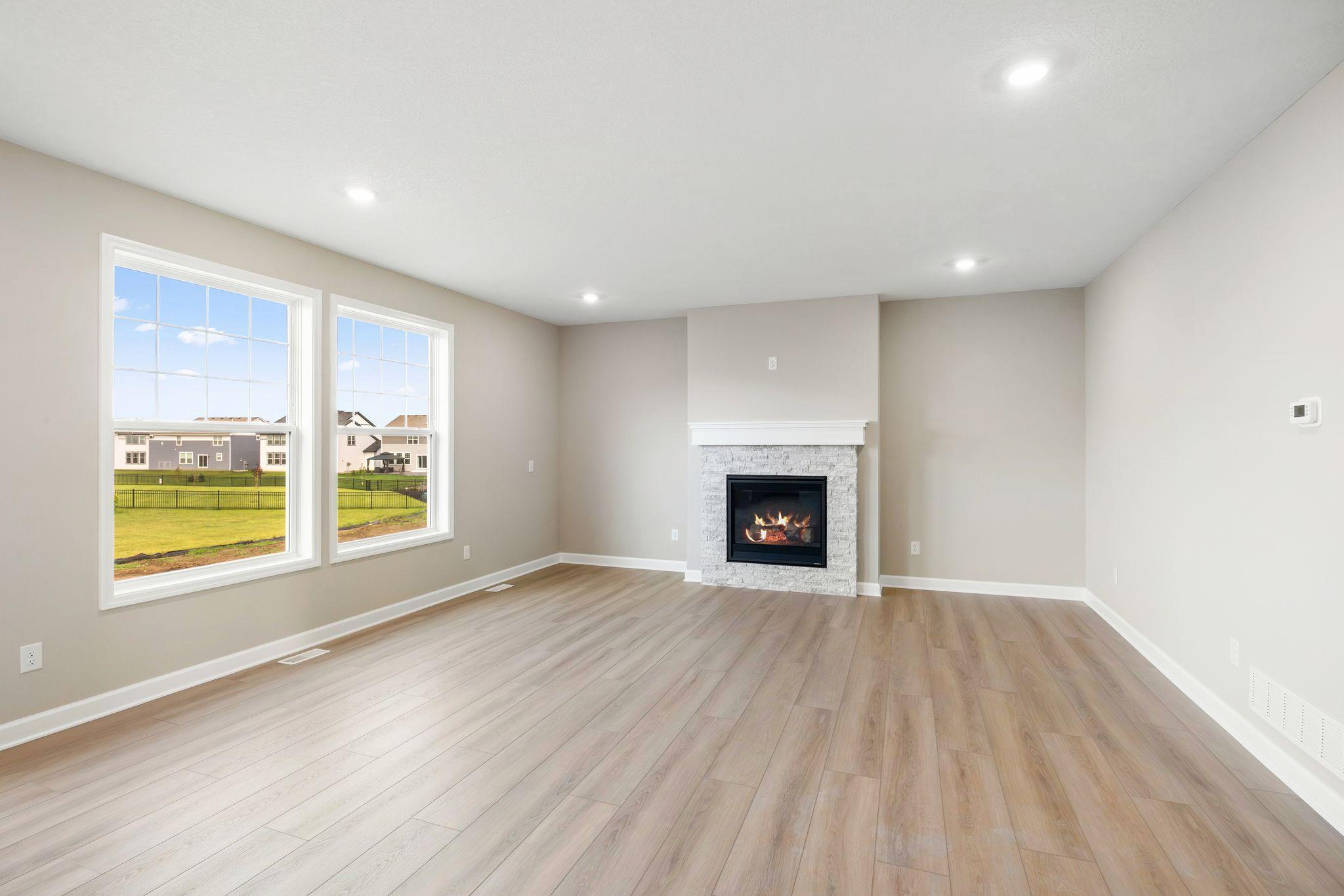 The Great Room features large windows for ample natural light and is the perfect place for gathering with friends and family.